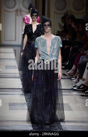 Models present creations during the Giorgio Armani Prive Spring-Summer 2006  Haute Couture fashion show in Hong Kong Thursday, March 30, 2006. Giorgio  Armani is seeking to expand his fashion empire in China -