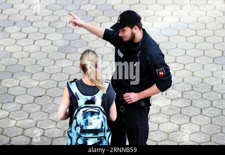 (170705) -- HAMBURG (GERMANY), July 5, 2017 -- A police officer stands guard near the Hamburg Messe in Hamburg, Germany, on July 5, 2017. The German armed forces (Bundeswehr) have issued a warning for all soldiers stationed in Hamburg against violent attacks from protestors at the upcoming G20 summit, the newspaper Spiegel reports on Wednesday. While the police are responsible for security during the G20 summit, they will receive assistance, upon request, from the armed forces. ) GERMANY-HAMBURG-G20 SUMMIT-SECURITY LuoxHuanhuan PUBLICATIONxNOTxINxCHN   Hamburg Germany July 5 2017 a Police Offi Stock Photo