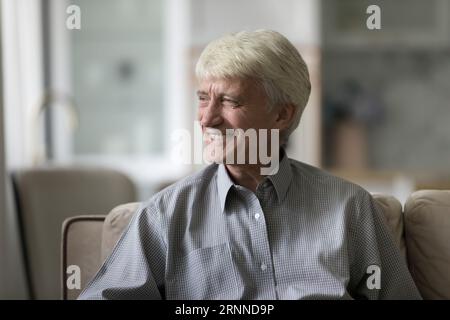 Happy thoughtful elder senior man thinking over retirement plans Stock Photo