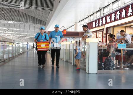 170718) -- SHANGHAI, July 18, 2017 -- Visitors pass by the