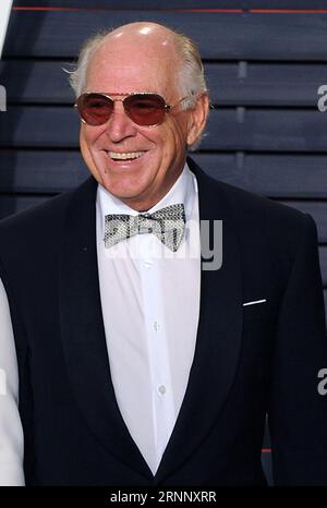 **FILE PHOTO** Jimmy Buffett Has Passed Away. BEVERLY HILLS - FEBRUARY 28: Jimmy Buffett at the Vanity Fair Oscar Party 2016 at the Wallis Annenberg Center for the Performing Arts on February 28, 2016 in Beverly Hills, California. Credit: PWPG/MediaPunch Stock Photo