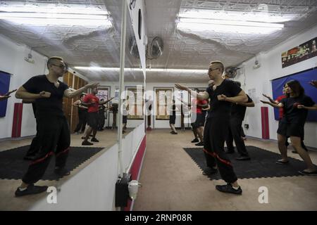 (170803) -- NEW YORK, Aug. 3, 2017 -- Alex Richter gives lessons to his high-level students at his Kung Fu school City Wing Tsun in New York, the United States, July 12, 2017. Hidden in the midtown of bustling New York City is City Wing Tsun . This is Alex Richter s Kung Fu school which features, as the name suggests, Wing Tsun, a Hong-Kong style martial art. As a native-born American kid, Richter was hugely influenced by the martial art films star Bruce Lee. His love towards Kung Fu, especially Wing Tsun, which Bruce Lee learned as a teenager, has been with him ever since. Richter started to Stock Photo