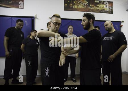 (170803) -- NEW YORK, Aug. 3, 2017 -- Alex Richter (front L) gives lessons to his high-level students at his Kung Fu school City Wing Tsun in New York, the United States, July 12, 2017. Hidden in the midtown of bustling New York City is City Wing Tsun . This is Alex Richter s Kung Fu school which features, as the name suggests, Wing Tsun, a Hong-Kong style martial art. As a native-born American kid, Richter was hugely influenced by the martial art films star Bruce Lee. His love towards Kung Fu, especially Wing Tsun, which Bruce Lee learned as a teenager, has been with him ever since. Richter s Stock Photo