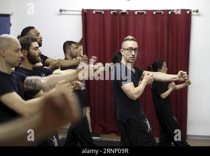 (170803) -- NEW YORK, Aug. 3, 2017 -- Alex Richter (R) gives lessons to his high-level students at his Kung Fu school City Wing Tsun in New York, the United States, July 12, 2017. Hidden in the midtown of bustling New York City is City Wing Tsun . This is Alex Richter s Kung Fu school which features, as the name suggests, Wing Tsun, a Hong-Kong style martial art. As a native-born American kid, Richter was hugely influenced by the martial art films star Bruce Lee. His love towards Kung Fu, especially Wing Tsun, which Bruce Lee learned as a teenager, has been with him ever since. Richter started Stock Photo