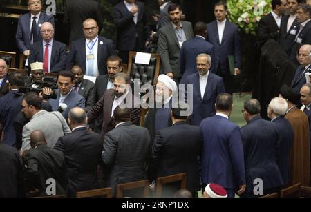 (170805) -- TEHRAN, Aug. 5, 2017 -- Hassan Rouhani (C) arrives for his inauguration ceremony as Iranian President in Iran s parliament in Tehran, capital of Iran, on Aug. 5, 2017. Hassan Rouhani was sworn in as Iranian President for his second term on Saturday and vowed to continue constructive interaction with the international community. ) IRAN-TERAHN-ROUHANI-PRESIDENT-INAUGURATION CEREMONY AhmadxHalabisaz PUBLICATIONxNOTxINxCHN   TEHRAN Aug 5 2017 Hassan Rouhani C arrives for His Inauguration Ceremony As Iranian President in Iran S Parliament in TEHRAN Capital of Iran ON Aug 5 2017 Hassan R Stock Photo