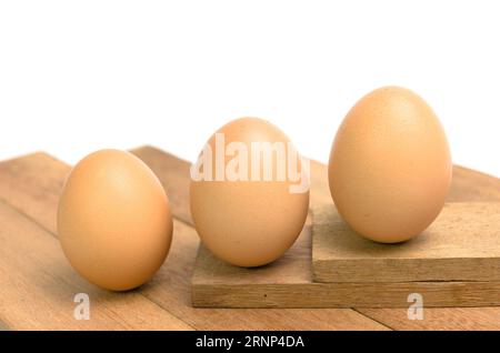 chicken eggs on wooden background Stock Photo