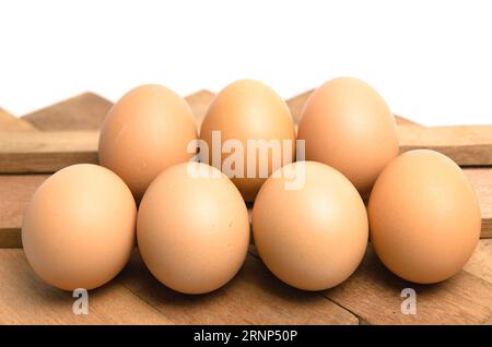chicken eggs on wooden background Stock Photo
