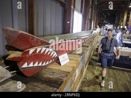(170813) -- VANCOUVER, Aug. 13, 2017 -- A visitor looks at an indigenous boat displayed during the 14th Richmond Maritime Festival in Richmond, Canada, on Aug. 12, 2017. The 14th Richmond Maritime Festival showcased maritime-themed activities and exhibitions to introduce Canada s maritime history and culture. ) (zy) CANADA-RICHMOND-14TH MARITIME FESTIVAL LiangxSen PUBLICATIONxNOTxINxCHN   Vancouver Aug 13 2017 a Visitor Looks AT to Indigenous Boat displayed during The 14th Richmond Maritime Festival in Richmond Canada ON Aug 12 2017 The 14th Richmond Maritime Festival showcased Maritime themed Stock Photo