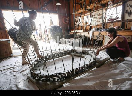 (170813) -- VANCOUVER, Aug. 13, 2017 -- Boat carpenters demonstrate how to make a Coracle - a traditional and primitive single person boat from Wales during the 14th Richmond Maritime Festival in Richmond, Canada, on Aug. 12, 2017. The 14th Richmond Maritime Festival showcased maritime-themed activities and exhibitions to introduce Canada s maritime history and culture. ) (zy) CANADA-RICHMOND-14TH MARITIME FESTIVAL LiangxSen PUBLICATIONxNOTxINxCHN   Vancouver Aug 13 2017 Boat Carpenters demonstrate How to Make a Coracle a Traditional and primitive Single Person Boat from Wales during The 14th Stock Photo