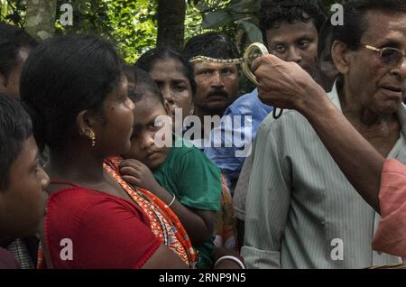 (170817) -- KHEDAITALA, Aug. 17, 2017 -- An Indian snake charmer makes blessing by snakes during the festival of the Hindu snake goddess Manasha at Khedaitala, some 75 kms north of Kolkata, capital of eastern Indian state West Bengal, Aug. 17, 2017. Many snake charmers and villagers attended this traditional festival to worship the goddess on Thursday. ) (gl) INDIA-KHEDAITALA-SNAKE FESTIVAL TumpaxMondal PUBLICATIONxNOTxINxCHN   Khedaitala Aug 17 2017 to Indian Snake Charmer makes Blessing by Snakes during The Festival of The Hindu Snake Goddess Manasha AT Khedaitala Some 75 KMS North of Kolkat Stock Photo