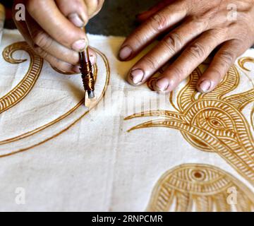 (170823) -- QIANDONGNAN, Aug. 23, 2017 -- A woman makes traditional hundred-bird clothing in Baibei Village of Rongjiang County, southwest China s Guizhou Province, Aug. 22, 2017. The hundred-bird clothing, embroidered with colorful silk and bird feathers, is the traditional dress for festivals and important occasions of Miao ethnic group. It takes local people several months to make a piece of hundred-bird clothing. )(mcg) CHINA-GUIZHOU-RONGJIANG-MIAO ETHNIC GROUP-COSTUME (CN) WangxBingzhen PUBLICATIONxNOTxINxCHN   Qiandongnan Aug 23 2017 a Woman makes Traditional Hundred Bird Clothing in  Vi Stock Photo