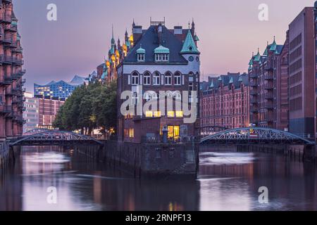 The City of Warehouses or the Speicherstadt with its main landmark, the Wasserschloss or the Watercastle. Photo taken on 8th of June 2023 in the UNESC Stock Photo