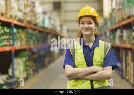 smart confident young teen caucasian worker in warehouse industry store manager staff standing happy smile Stock Photo