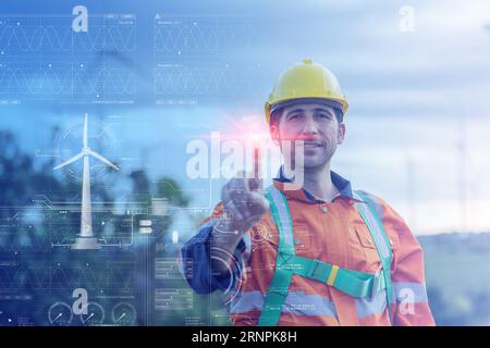 electricity engineer male overlay wind turbine power inforgraphic for smart software help service monitoring energy saving concept Stock Photo