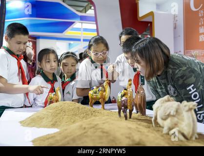 (170912) -- BEIJING, Sept. 12, 2017 -- Pupils visit the first China Beijing International Language & Culture Expo (ILCE) in Beijing, capital of China, Sept. 12, 2017. The first China Beijing ILCE would be held here from Sept. 11 to 13. )(wjq) CHINA-BEIJING-LANGUAGE & CULTURE EXPO (CN) ShenxBohan PUBLICATIONxNOTxINxCHN Stock Photo