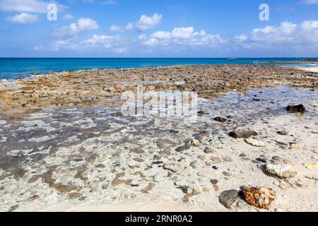 The scenic view of rocky Seven Mile Beach on Grand Cayman island (Cayman islands). Stock Photo