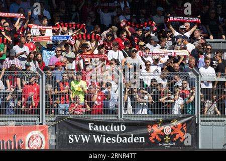 Wiesbaden, Germany. 02nd Sep, 2023. Soccer: 2nd Bundesliga, Matchday 5, SV Wehen Wiesbaden - FC Schalke 04 at the BRITA Arena. Wehen-Wiesbaden fans sing their anthem. Credit: Jürgen Kessler/dpa - IMPORTANT NOTE: In accordance with the requirements of the DFL Deutsche Fußball Liga and the DFB Deutscher Fußball-Bund, it is prohibited to use or have used photographs taken in the stadium and/or of the match in the form of sequence pictures and/or video-like photo series./dpa/Alamy Live News Stock Photo