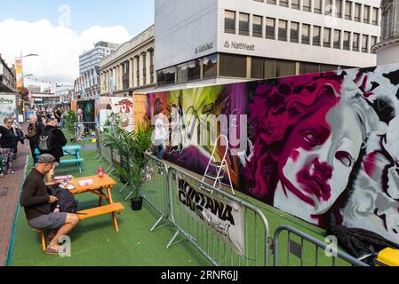 Southend City Jam and events taking place in the pedestrianised High Street of Southend on Sea, Essex, UK. Graffiti art in progress with tables Stock Photo