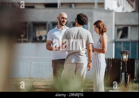 Aesthetic architects collaborating on blueprint for modernized building. Successful teamwork in urban design and structural engineering. Stock Photo