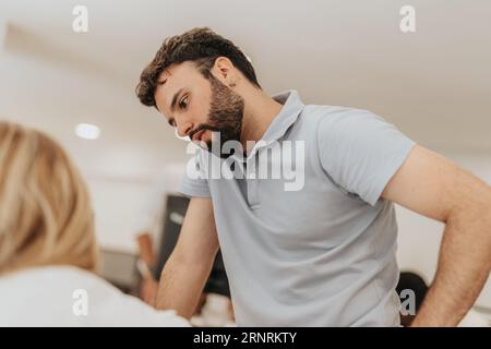 Business team analyzing statistics, collaborating, and discussing profit growth. Diverse employees in a positive working atmosphere, sharing ideas and Stock Photo