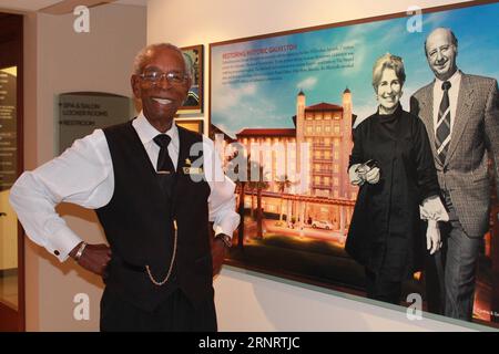 (171015) -- HOUSTON, Oct. 15, 2017 -- Galveston historian and museum tour guide Bobby Hilton shows a display at the Hall of History Museum in Galveston, Texas, the United States, on Oct. 2, 2017. Hilton, 84, is a sought-after historian on all things in Texas, and has plenty of first-person stories to share to bring that history to life. The father of five serves as museum director and tour guide at the Hotel Galvez & Spa in Galveston. He has spent much of his life in and around the historic hotel, working before World War II as a busboy in the restaurant, and returning in the 1990s to run and Stock Photo