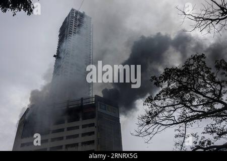 (171019) -- KOLKATA, Oct. 19, 2017 --Smoke rises from a commercial building where a fire brke out in central Kolkata, India, Oct. 19, 2017. A major fire broke out at a highrise office building in the eastern Indian city of Kolkata on Thursday, officials said. ) (srb) INDIA-KOLKATA-FIRE ACCIDENT TumpaxMondal PUBLICATIONxNOTxINxCHN Stock Photo