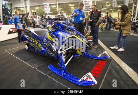 (171021) -- TORONTO, Oct. 21, 2017 -- A visitor learns information about a snowmobile during the 2017 Toronto International Snowmobile, ATV & Powersports Show in Toronto, Canada, Oct. 20, 2017. With about one thousand of vehicles from more than 20 major exhibitors, the annual three-day show kicked off on Friday for thousands of enthusiasts. )(cl) CANADA-TORONTO-INTERNATIONAL SNOWMOBILE ATV & POWERSPORTS SHOW ZouxZheng PUBLICATIONxNOTxINxCHN Stock Photo