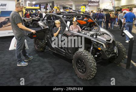 (171021) -- TORONTO, Oct. 21, 2017 -- Visitors try an ATV during the 2017 Toronto International Snowmobile, ATV & Powersports Show in Toronto, Canada, Oct. 20, 2017. With about one thousand of vehicles from more than 20 major exhibitors, the annual three-day show kicked off on Friday for thousands of enthusiasts. )(cl) CANADA-TORONTO-INTERNATIONAL SNOWMOBILE ATV & POWERSPORTS SHOW ZouxZheng PUBLICATIONxNOTxINxCHN Stock Photo