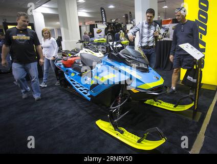 (171021) -- TORONTO, Oct. 21, 2017 -- People view a snowmobile during the 2017 Toronto International Snowmobile, ATV & Powersports Show in Toronto, Canada, Oct. 20, 2017. With about one thousand of vehicles from more than 20 major exhibitors, the annual three-day show kicked off on Friday for thousands of enthusiasts. )(cl) CANADA-TORONTO-INTERNATIONAL SNOWMOBILE ATV & POWERSPORTS SHOW ZouxZheng PUBLICATIONxNOTxINxCHN Stock Photo