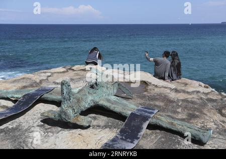 (171022) -- SYDNEY, Oct. 22, 2017 -- Visitors take selfie at the Bondi beach in Sydney, Australia, on Oct. 22, 2017. Sculpture by the Sea, Australia s famous annual outdoor art exhibition, celebrated its 21st anniversary this year. ) (swt) AUSTRALIA-SYDNEY-SCULPTURES BaixXuefei PUBLICATIONxNOTxINxCHN Stock Photo