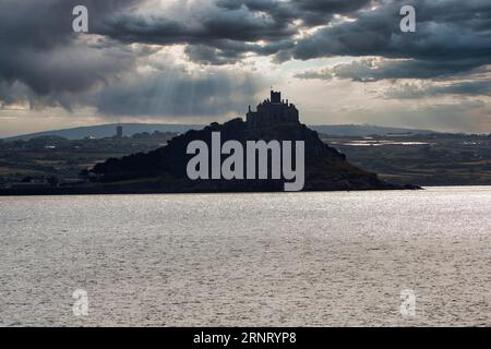 Dark clouds over St Michael's Mount, backlight, view from Penzance, Cornwall, England, Great Britain Stock Photo