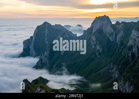 Alpstein, valley of Meglisalp at sunrise, high fog in the valley, Saentis, Appenzell Ausserrhoden, Appenzell Alps, Switzerland Stock Photo