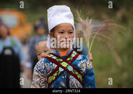 (171028) -- QIANDONGNAN, Oct. 28, 2017 -- A villager celebrates the Duan Festival in traditional costumes in Gaopai Village, Qiandongnan Miao and Dong Autonomous Prefecture, southwest China s Guizhou Province, Oct. 27, 2017. The Duan Festival, the most important of the Shui ethnic group, is celebrated from late August to early October of the Chinese traditional lunar calendar. ) (zwx) CHINA-GUIZHOU-SHUI ETHNIC GROUP-DUAN FESTIVAL (CN) HuangxXiaohai PUBLICATIONxNOTxINxCHN Stock Photo