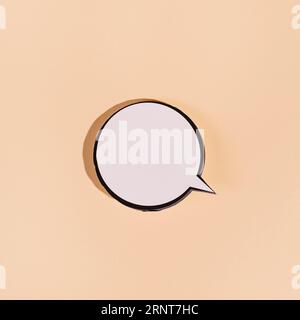 Blank round speech bubble beige background Stock Photo