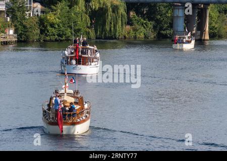 River Thames, Staines, Surrey, England, UK, September 2nd 2023. The 28th Annual Veterans Cruise took place over the weekend. The event is organised by the Association of Dunkirk Little Ships (ADLS), and welcomes some of the last veterans from Operation Dynamo, Normandy Veterans, Chelsea Pensioners, Far East Prisoners of War, ladies who served in the WRENS during WWII and Coastal Forces Veterans. The fleet departed from Penton Hook Marina in Chertsey, cruised to Staines-upon-Thames, turned and went back. Stock Photo