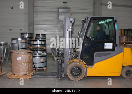 (171124) -- BUDAPEST, Nov. 24, 2017 -- A man works with a forklift in Ghibli Logistics Park in Csepel Port, in Budapest, Hungary on Nov. 10, 2017. A trade hub established by a Chinese enterprise in Hungary has been acting as a matchmaker between Chinese and European businesses, and is poised to further facilitate bilateral trade cooperation as the Belt and Road Initiative continues to unfold, the company s CEO has said. ) (lx) TO GO WITH XINHUA STORY: Interview: Chinese-operated trade hub in Hungary facilitates cooperation with European businesses HUNGARY-CHINESE-OEPRATED TRADE HUB YangxYongqi Stock Photo