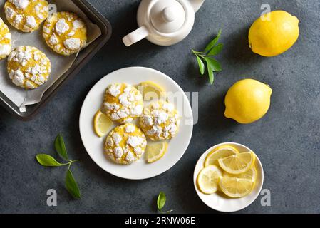 Lemon crinkle cookies over blue stone background. Top view, flat lay Stock Photo