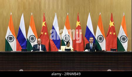 (171211) -- NEW DELHI, Dec. 11, 2017 -- Chinese Foreign Minister Wang Yi (R) addresses a press conference after the 15th trilateral meeting of the foreign ministers of China, Russia and India with his Russian counterpart Sergei Lavrov (L) and Indian counterpart Sushma Swaraj in New Delhi, India, on Dec. 11, 2017. ) INDIA-NEW DELHI-THE 15TH TRILATERAL MEETING-CHINA-RUSSIA ZhangxNaijie PUBLICATIONxNOTxINxCHN Stock Photo