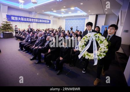 (171212) -- THE HAGUE, Dec. 12, 2017 -- People lay a wreath to mourn the victims of Nanjing Massacre during a memorial in The Hague, the Netherlands, on Dec. 12, 2017. Some 200 Chinese people and students living in the Netherlands attended a memorial of Nanjing Massacre, held one day ahead of China s National Memorial Day for Nanjing Massacre Victims. ) THE NETHERLANDS-THE HAGUE-NANJING MASSACRE-MEMORIAL RickxNederstigt PUBLICATIONxNOTxINxCHN Stock Photo