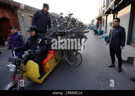 (171216) -- BEIJING, Dec. 16, 2017 -- Wang Junli (1st R) talks with property personnels in the Xicheng District of Beijing, capital of China, Dec. 12, 2017. Wang is one of the street chiefs appointed by the local government to manage the enviroment and order of streets. ) (zkr) CHINA-BEIJING-STREET CHIEFS(CN) JuxHuanzong PUBLICATIONxNOTxINxCHN Stock Photo