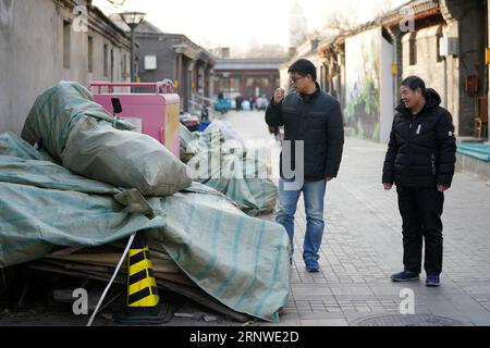 (171216) -- BEIJING, Dec. 16, 2017 -- Gao Bo (L) checks the environment of Dazhiqiao Hutong in the Xicheng District of Beijing, capital of China, Dec. 13, 2017. Gao is one of the street chiefs appointed by the local government to manage the enviroment and order of streets. ) (zkr) CHINA-BEIJING-STREET CHIEFS(CN) JuxHuanzong PUBLICATIONxNOTxINxCHN Stock Photo