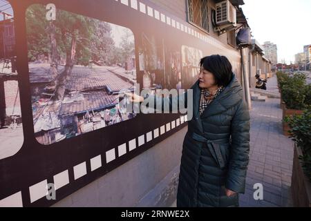 (171216) -- BEIJING, Dec. 16, 2017 -- Wang Xiuyun introduces the situation of street before renovation in the Dongcheng District of Beijing, capital of China, Dec. 11, 2017. Wang is one of the street chiefs appointed by the local government to manage the enviroment and order of streets. ) (zkr) CHINA-BEIJING-STREET CHIEFS(CN) JuxHuanzong PUBLICATIONxNOTxINxCHN Stock Photo