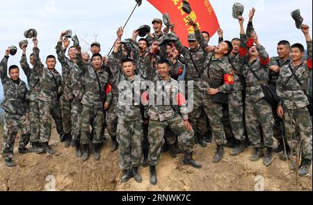 (171223) -- JINGXI, Dec. 23, 2017 -- Chinese soldiers cheer after conducting demining mission in the Guangxi section along the China-Vietnam border in south China s Guangxi Zhuang Autonomous Region, Dec. 22, 2017. Chinese soldiers began their new landmine-sweeping mission along the China-Vietnam border on Nov. 27, 2017, covering 2.05 million square meters in 53 sites close to the Guangxi border. ) (ry) CHINA-GUANGXI-VIETNAM-BORDER-DEMINING MISSION (CN) ZhouxHua PUBLICATIONxNOTxINxCHN Stock Photo