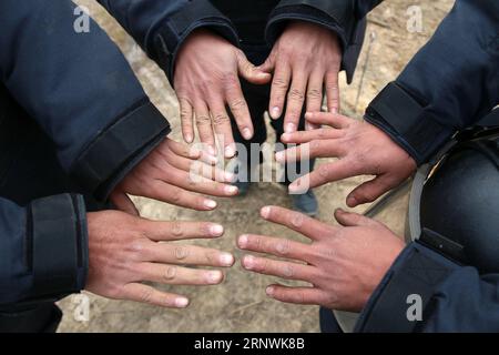 (171223) -- JINGXI, Dec. 23, 2017 -- Chinese soldiers show their hands when conducting demining mission in the Guangxi section along the China-Vietnam border in south China s Guangxi Zhuang Autonomous Region, Dec. 22, 2017. Chinese soldiers began their new landmine-sweeping mission along the China-Vietnam border on Nov. 27, 2017, covering 2.05 million square meters in 53 sites close to the Guangxi border. ) (ry) CHINA-GUANGXI-VIETNAM-BORDER-DEMINING MISSION (CN*) ZhouxHua PUBLICATIONxNOTxINxCHN Stock Photo