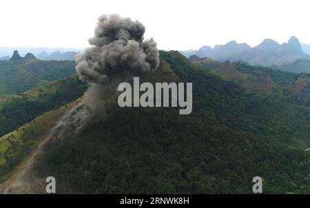 171223 -- JINGXI, Dec. 23, 2017 -- Chinese soldiers conduct blasting operations to clear plants before landmine removal efforts in the Guangxi section along the China-Vietnam border in south China s Guangxi Zhuang Autonomous Region, Dec. 22, 2017. Chinese soldiers began their new landmine-sweeping mission along the China-Vietnam border on Nov. 27, 2017, covering 2.05 million square meters in 53 sites close to the Guangxi border.  ry CHINA-GUANGXI-VIETNAM-BORDER-DEMINING MISSION CN ZhouxHua PUBLICATIONxNOTxINxCHN Stock Photo