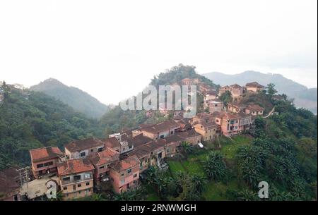 (171225) -- QIANXINAN, Dec. 25, 2017 -- Photo taken on Dec. 24, 2017 shows houses at an ethnic Yao village of Youmai, Wangmo County, southwest China s Guizhou Province. ) (wyo) CHINA-GUIZHOU-YAO VILLAGE (CN) LiuxChaofu PUBLICATIONxNOTxINxCHN Stock Photo