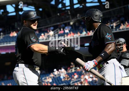 Miami Marlins' Jake Burger celebrates his home run during the