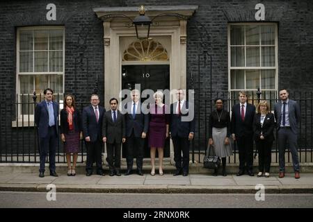 (180109) -- LONDON, Jan. 9, 2018 -- British Prime Minister Theresa May (C) poses for a picture outside 10 Downing street with Conservative Party Chairman Brandon Lewis (5th L) and Conservative Party Deputy Chairman James Cleverly (5th R), with Conservative vice chair members as she announces new ministerial appointments to her front bench in a Cabinet reshuffle beginning today, in London, Britain on Jan. 8, 2018. ) BRITAIN-LONDON-CABINET RESHUFFLE TimxIreland PUBLICATIONxNOTxINxCHN Stock Photo