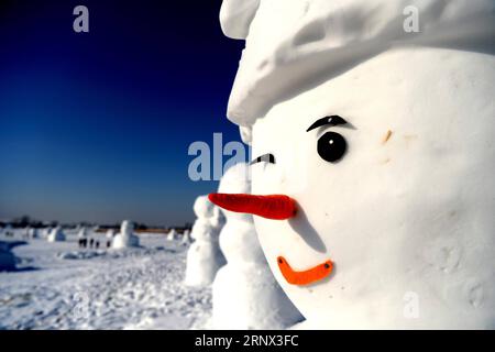 (180111) -- HARBIN, Jan. 11, 2018 -- Snowman sculptures are seen at an ice and snow park in Harbin, capital of northeast China s Heilongjiang Province, Jan. 11, 2018. Altogether 2,018 cute snowmen were displayed here to greet the year 2018. ) (zwx) CHINA-HARBIN-SNOWMAN (CN) WangxKai PUBLICATIONxNOTxINxCHN Stock Photo