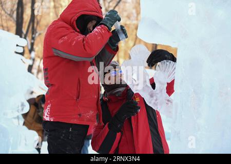 (180111) -- HARBIN, Jan. 11, 2018 -- Contestants carve an ice sculpture during the 37th national ice sculpture competition in Harbin, capital of northeast China s Heilongjiang Province, Jan. 11, 2018. The 3-day competition, with the participation of more than 60 contestants, closed here on Thursday. ) (yxb) CHINA-HARBIN-ICE SCULPTURE-COMPETITION (CN) WangxSong PUBLICATIONxNOTxINxCHN Stock Photo